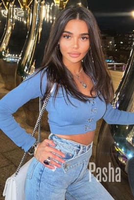 Fit and busty young Baltic girl in jeans and a blue top