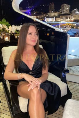 Beautiful young Russian girl sitting in al fresco in a fancy restaurant