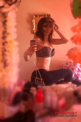 Stylish selfie taken by a sexy escort girl in a mirror