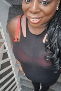 Close up selfie of a smiling black girl with red lipstick