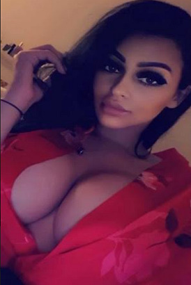 Very busty girl with top open in selfie