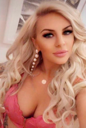 Gorgeous busty blond in a pink top
