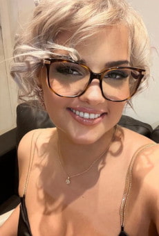 Close up selfie photo of a beautiful blonde wearing glasses