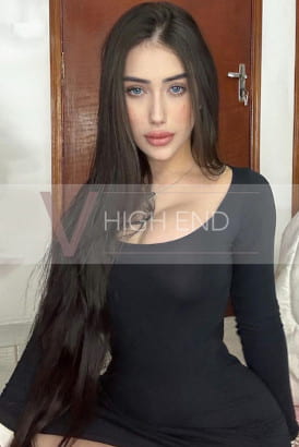 Sultry brunette in a black dress